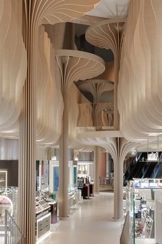 the interior of a jewelry store with wooden columns