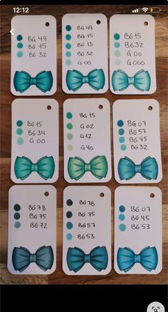 six tags with blue bow ties on them