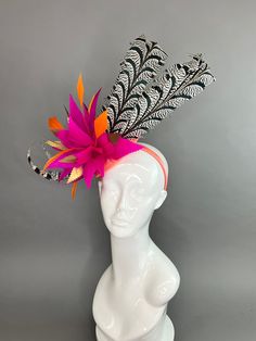 Pink sinamay fascinator base adorned with curled Lady Amherst feathers and fuchsia pink and orange cut feathers. made to be worn on the right side. Fascinators are one size fits all. don’t forget to follow us on instagram @TheHatHive Pink Ostrich Feather Fascinator, Multicolor Carnival Headband Fascinator, Multicolor Feathered Fascinator For Kentucky Derby, Multicolor Feather Fascinator For Kentucky Derby, Orange Fascinators, Sinamay Fascinator, Orange Cut, Feather Fascinators, Fuchsia Pink