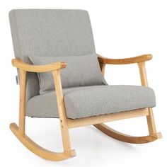 the rocking chair is made from wood and has grey upholstered fabric on it