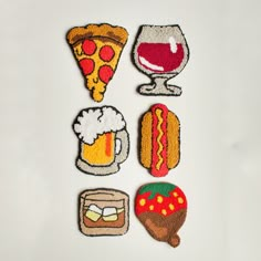 four embroidered patches with different foods and drinks on them, including pizza, hotdogs, fries, and beer