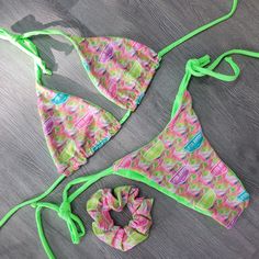 Introducing the Mariah LR Lime: a luxurious swimsuit collaboration between Lifted Rippers and BB Beekinis. Neon swirls Reversible to a solid Vibrant Lime, this fun design features tie traditional triangle top. Simple tie side bottoms with a scrunch in the butt! All reversible too! Set your style apart this season with a custom one of a kind Bikini! BOTTOM ONLY Top here Triangle Top Swimwear With Drawstring For Festival, Green Triangle Top Swimwear With Drawstring, Summer Festival Swimwear With Drawstring, Green Tropical Swimwear For Festival, Green Tie-back Swimwear For Beach Party, Green Halter Neck Swimwear For Festivals, Green Tie-side Bottom Swimwear For Festival, Green Tie-side Swimwear For Festivals, Green Festival Swimwear With Tie-side Bottom