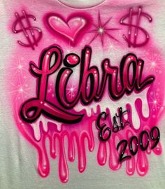 a t - shirt with the words libra est 2009 written in black and pink