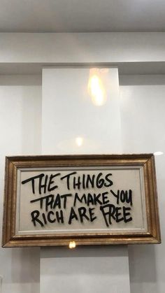 a framed sign that says the things that make you rich are free