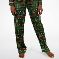 Indulge in the luxury you truly deserve. Treat yourself to a remarkable night's sleep this Holiday Season with our exquisite Christmas Tree African Print satin pajama set, adorned with a captivating Christmas Trees. Crafted to offer unparalleled comfort, these pajamas will have you feeling like royalty as you slip into a tranquil slumber.Experience the unmatched softness of our satin fabric, akin to the gentle touch of butter on your skin. The supple, satiny texture guarantees you'll ascend to c Christmas Pajama Party Sleepwear Long Pants, Christmas Holiday Sleepwear With Long Pants, Christmas Holiday Long Pants Sleepwear, Festive Holiday Sleepwear, Festive Holiday Long Sleeve Sleepwear, Festive Long Sleeve Holiday Sleepwear, Satin Pajama Set, Satin Pajama, Mens Sleepwear