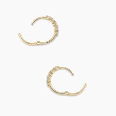 Description A cluster of diamonds various shapes creates a beautiful, eye-catching design on these 14k gold huggie hoop earrings. We love the way these earrings look in first piercings. Make it a single Product Details 1.29 total carat weight Ten 1.5 mm GI SI1- I1 diamonds 14k solid gold 12 mm profile diameter and 1.2 mm wide Hinge closure White Aura, Gold Huggie Hoop Earrings, Earrings Stacking, Black Labradorite, Orange Agate, Yellow Opal, Iridescent Crystal, Beautiful Eye, 14k Gold Necklace