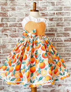 This sweet dress is perfect for your orange themed party or photoshoot! It has a twirling skirt trimmed in ricrac and a reverse knot bodice with the cutest detailing. We typically recommend ordering the size corresponding with age for the best fit. This dress is made to be worn at an above the knee vintage length. Playful Orange Sleeveless Dress, Playful Peach Summer Dress, Playful Peach Spring Dress, Orange Sleeveless Dress With Ruffle Hem, Orange Ruffled Dress For Dress-up, Orange Ruffled Dress For Dress-up Occasions, Orange Ruffled Dress For Garden Party, Cute Orange Sleeveless Dress, Fitted Orange Dress With Ruffles