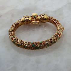 Luxury Jeweled Yellow Gold Bracelets, Luxury Ceremonial Gemstone Jewelry, Fine Jewelry Multi-stone Bracelet, Fine Jewelry Yellow Gold Multi-stone Bangle, Yellow Gold Multi-stone Bangle In Fine Jewelry Style, Unique Formal Gemstone Bangle, Unique Formal Bangle With Gemstone, Luxury Multicolor Bangle, Luxury Multicolor Round Bangle