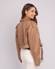 A cropped leather jacket is a foolproof way to polish off an outfit, without feeling weighed down in bulk. The shorter hem of our Marlin leather jacket for women is perfect for experimenting with proportions, whether paired with high-waisted jeans for daily wear or a mini skirt for evenings out. Handcrafted from the finest lamb leather, this cropped moto jacket only improves with age. Complete with an off-center zipper closure, belt detail, zipper pockets, and a bold collar adorned with silver h Fall Cropped Belted Jacket, Chic Belted Cropped Outerwear, Chic Cropped Belted Outerwear, Cropped Leather Winter Outerwear, Beige Leather Biker Jacket For Work, Belted Cropped Jacket For Spring, Beige Leather Biker Jacket For Fall, Cropped Beige Fall Outerwear, Cropped Beige Outerwear For Fall