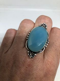 Vintage Blue Chalcedony ring statement cocktail Size 8 Large genuine blue chalcedony Vintage ring Low content silver not sterling. Can be re sized at my jeweler. $10-$20 All rings are shipped free in the US in a nice gift box. Check out our over a THOUSAND great reviews Engraving is $4 per letter and is not always perfect depending on the piece. It can take a few days if the jeweler is busy. This is payable to Paypal Judithsltd@gmail.com Turquoise Chalcedony Ring Jewelry, Turquoise Chalcedony Gemstone Rings, Blue Chalcedony Cabochon Rings, Formal Blue Chalcedony Ring, Blue Chalcedony Ring, Azul Vintage, Chalcedony Ring, Real Turquoise, Blue Jewelry