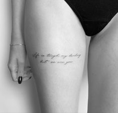 a woman's thigh with an inscription on it