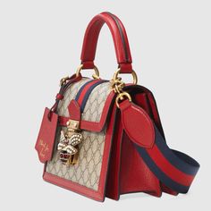 Description An eclectic mixture of historical Gucci details and newly established codes, for the Pre-Fall 2018 the Queen Margaret line is presented in GG canvas, a versatile fabric that continues to pay homage to the House’s roots. Inspired by the ’70s archives, a bee enriched by glass pearls and multicolor crystals defines the closure of this small top handle bag, trimmed in red leather. Size: 10″W x 7″H x 5″D / W25cm x H18cm x D13cm 100% genuine materials, matching the quality of the Gucci pro Gucci Top Handle Bag, Queen Margaret, Small Top Handle Bag, Moschino Bag, Gucci Store, Bag Gucci, Perfect Handbag, Designer Totes, Purse Styles