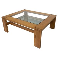 a wooden coffee table with glass top and legs on white background, side view showing the bottom part of the table