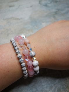 "This stunning handmade bracelet set features a gorgeous combination of White Howlite, Pink Quartz, Austrian cut glass, Blue Moonstone and Zebra Jasper crystal beads. Each bead is carefully selected and arranged to create a unique and eye-catching design that will complement any boho chic outfit. *:･ﾟ･ﾟ White Howlite is known to facilitate the manifestation of ambitions and dreams by bringing new ideas into focus. Its gentle and peaceful energy helps soothe an overactive mind, promoting a sense Adjustable White Rose Quartz Jewelry, White Bohemian Stackable Crystal Bracelet, Adjustable White Rose Quartz Beaded Bracelets, White Stackable Crystal Bracelet As Gift, White Stackable Crystal Bracelet Gift, Stackable White Crystal Bracelet Gift, White Rose Quartz Bohemian Jewelry, Bohemian White Rose Quartz Jewelry, White Crystal Bracelet With Gemstone Beads