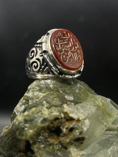 A silver ring made in the old Ottoman way. Inlaid with Yemeni agate stone. The ring is completely handmade and engraved on the stone with the distinctive Arabic. We offer special handmade products suitable for women and man, They can be used as a nice gift for any event or occasion. we have a variety of designs and shapes. our clients can decide how they want their product to be, as we can put any text, number or name on the product. Our products are made by passion & 20 years of experience. Our products are guaranteed for Lifetime. Our products can be weared every day (24/7) Our products can be personalized depending on the client's requests Our products come with an Elegant & modern box which suits all occasions. ✦ Item Details ✦ * Finish: Oxidized  * Material: 925k Sterling Silver  * Co Traditional Silver Intaglio Rings, Artisan Carved Ring As A Gift, Artisan Carved Ring As Gift, Traditional Engraved Ring As Gift, Artisan Carved Rings As Gifts, Artisan Carved Rings For Gift, Traditional Engraved Ring For Gift, Traditional Carved Signet Ring Gift, Traditional Carved Signet Ring For Gift