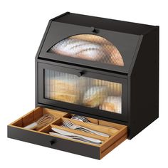 an open drawer with utensils in it