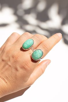 This beautiful Chrysoprase ring is a colourful statement piece to add to your jewellery collection. The ring is made using 925 sterling silver. Available in size 8 1/4. Dimensions: Total height: 23mm Total width: 15mm Stone height: 20mm Stone width: 12mm Stone + bezel thickness: 9mm Band width: 4mm - Please note - * Additional photos and videos available on request * Go to 'About us' section for links to our socials and website * Only the ring from second picture is included in the price. * Gemstones are natural material, they can slightly differ in color, size, shape and may show some inclusions or cracks inside the stone itself. We do take great care in picking the best quality stones for best quality jewellery. Jade Rings With Natural Stones For Gift, Gift Rings With Natural Jade Stones, Oval Jade Ring With Natural Stones, Untreated Jade Jewelry Gift, Untreated Jade Jewelry For Gift, Silver Amazonite Gemstone Jewelry, Green Oval Moonstone Ring In Sterling Silver, Adjustable Silver Chrysoprase Jewelry, Adjustable Silver Jewelry With Chrysoprase