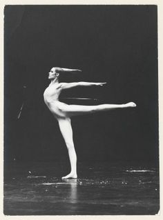 a black and white photo of a ballerina in the middle of an acrobatic pose