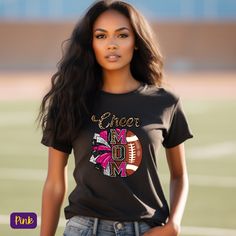 📣 Unite the Spirit Our "Cheer Moms" tee brings together the spirited worlds of cheerleading and football in one dazzling design. With a half pom-pom and half football, it's the perfect way for cheer moms to showcase their unwavering support for their team. Available in popular school colors, this shirt is a symbol of school spirit that's hard to miss. 🌟 Premium Comfort, Tailored Fit Crafted with care, this tee boasts a universal fit, ensuring comfort for every cheer mom. Made from 100% premium Black Sublimation Print T-shirt For Cheerleading, Black T-shirt With Sublimation Print For Cheerleading, Black T-shirt With Team Name For Cheerleading, Black Sports Fan T-shirt For Cheerleading, Black T-shirt For Cheerleading Fan Apparel, Black Fan Apparel T-shirt For Cheerleading, Black Graphic Print Top For Cheerleading, Sports Fan T-shirt For Football Season Cheerleading, Black Tops With School Spirit For Cheerleading