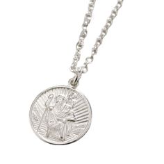 This gorgeous Men's St Christopher Necklace is made by our jewellers from 925 Sterling Silver.This necklace features an embossed Saint Christopher coin. Saint Christopher is the patron saint of all travellers. This necklace makes the perfect gift for any travel fan.Made from: This necklace is made from 925 sterling silver.Dimensions: Disc is approx. 1.6cm diameter and 1mm thick. Chain is 18" Long. Each item is individually handmade to order in our Brighton workshop. All of our items are handmade Silver Polished Medallion Necklace, White Gold Coin Necklace With Polished Finish, Sterling Silver Engraved Spiritual Coin Necklace, Spiritual Sterling Silver Engraved Coin Necklace, Silver Medallion Coin Necklace With Polished Finish, Classic Engraved Sterling Silver Coin Necklace, White Gold Engraved Sterling Silver Medallion Necklace, Silver Sterling Silver Symbolic Coin Necklace, Silver Engraved Symbolic Coin Necklace