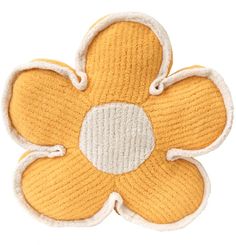 a yellow and white flower shaped object on a white background