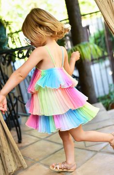 Rainbow coloring and floral appliqués add kid-friendly appeal to a dress with a swingy tiered silhouette for endless twirls. Lined 100% polyester Hand wash, dry flat Made in the USA of imported fabric Playful Multicolor Tiered Dress, Multicolor Tiered Summer Dress, Playful Spring Twirl Dress For Playdate, Multicolor Tiered Ruffle Dress, Spring Multicolor Tiered Dress, Summer Rainbow Dress For Dress-up, Rainbow Dress For Summer Dress-up, Rainbow Dresses For Summer Dress-up, Summer Twirl Dress With Ruffles For Playtime