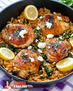 chicken and rice with lemons in a skillet on a table cloth next to parsley