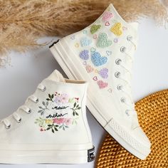 '' Converse Heart, Wedding Sneaker for Bride, Custom Converse Embroidered Heart, Name, Bridal Flower,  Personalized Bridal Shoes '' 🍀 Price includes Converse Shoes and Floral Embroidery Designs as shown 🍀 🍀 Shoe Type: Converse 1970s 🍀 Shoe color: 2. Invory_1970s 1. DETAILS 🍀 You can send me your Converse, Vans, canvas shoes or I can buy them for you. Custom-ordered embroidered Vans and Converse shoes, please wait another 2-4 days. Each pair is hand embroidered to order, please make sure you put in the correct shoe size before you check out. The embroidery is meticulous and does not fade. 🍀 You will receive Vans and Converse shoes with floral embroidery designs as above. 2. PERSONAL EXPRESSION 🍀 Create your unique vibe by your own design of embroidery! In addition to the embroidery p Wedding Converse Shoes, Converse Shoes Custom, Wedding Sneakers For Bride, Bride Sneakers, Wedding Shoes Sneakers, Converse Wedding Shoes, Custom Wedding Shoes, Embroidered Converse, Embroidery Wedding