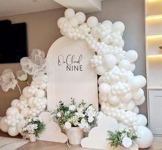 balloons and flowers decorate the entrance to a wedding