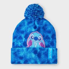 Amp up your accessories with the Girls' Disney Stitch Tie-Dye Pom Beanie. This fashion beanie is made of midweight knit fabric with ribbed cuffs for all-day cozy comfort. It features Disney Stitch detailing with a pom-pom accent on the top to add a cute touch to their cool-weather outfit. Plus, the pull-on style allows for easy on and off making it a must have for your winter wardrobe. Fashion Beanie, Kids Winter Hats, Cute Beanies, Girls Disney, Girls Fleece, Disney Lilo, Tie Dye Designs, Acrylic Fabric, Disney Stitch