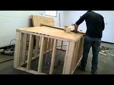 a man is working on some wooden furniture