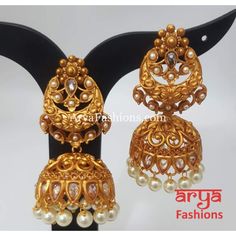 Golden Triple Jhumka Earring with golden beads Premium Quality Kundan Jhumka Earrings Length: Approx. 2.65" Light-weight Push-Back closure Gold Finish on high-quality brass as the base metal, Kundan stones and Pearls Suitable for any traditional or contemporary attire and occasion In-stock & ready-to-ship **Color may vary slightly due to photography and lighting. Golden Jhumka Earrings, Golden Jhumka, Kundan Jhumka Earrings, Kundan Jhumka, Indian Jhumka, Matte Gold Earrings, Gold Earrings Indian, Traditional Indian Jewellery, Golden Beads