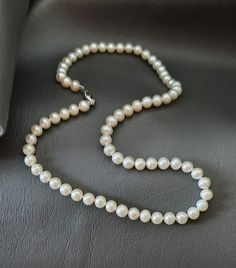 "These beautiful freshwater pearls are ready to wear any time of day or night.  The pearls are 6mm near round white ,head knotted and accompanied by a 14k white gold pearl clasp.  The necklace is 18\"." Classic Formal Pearl Necklace With 8mm Beads, Classic 8mm Bead Pearl Necklace For Formal Occasions, Pearl White Necklace With Sterling Silver Clasp, Classic Pearl Necklace For Wedding With 8mm Beads, Classic Wedding Pearl Necklace With 8mm Beads, Akoya Pearl Necklace With Sterling Silver Clasp, Pearl Necklace With 8mm Beads, Pearl White Pearl Necklace With 8mm Beads, Round Akoya Pearl Necklace With Sterling Silver Clasp