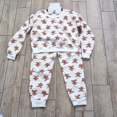 You Can't Catch Me, I'm The Gingerbread Man! Nwt 2 Piece Winter Christmas Holiday Gingerbread Man Jogger Pajama Pj Lounge Set In White With Randomly Placed Images Of Gingerbread Men, Size Medium The Set Is A Cozy Sweatshirt Material With A Brushed Fleece Interior Top Is Long Sleeved With Crew Neck Neckline And Is Cropped Stretchy Ribbed Material At Neck, Wrists, Ankles, And Bottom Hem For A Comfortable Fit Bottoms Have An Elastic Waist With Working Drawstring 2 In Seam Pockets 100 Percent Polyes The Gingerbread Man, Gingerbread Men, Cozy Sweatshirts, Lounge Set, Better Together, Gingerbread Man, Winter Christmas, 100 Percent, Women's Intimates