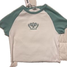 Trendy Streetwear Tops With Embroidered Logo, Trendy Streetwear Top With Embroidered Logo, Trendy Embroidered Logo Top For Streetwear, White Top With Embroidered Logo For Streetwear, Sporty Spring Tops With Embroidered Logo, White Tops With Embroidered Logo For Spring, Trendy Cotton Tops With Embroidered Logo, Sporty Embroidered Cotton T-shirt, Green Cotton Top With Embroidered Graphics