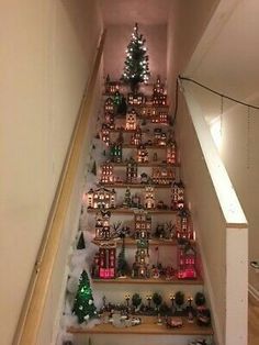 there are many christmas decorations on the stairs