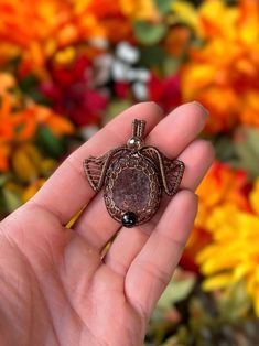 ITEM DESCRIPTION: Wire-wrapped pitbull or chocolate Labrador dog head-shaped pendant made with a strawberry sunstone stone as the face, a faceted topaz bead on the bail, and two black jasper beads as the nose on either side. Pendant is made to be reversible with a face made of wire on the back.  Wires used are 16G, 26G & 28G antique brass (Artistic Wire brand. Pendant size approx. 1.25" x 1.25" and comes strung on an adjustable black cord (not pictured), NOTE ON MATERIALS/DESIGN:  *Please ensure that you do not have allergies to the listed metals. I do not accept returns/all sales are final. This design is one I have created myself from scratch and is unique to my Marz Boutique LLC brand. If you see this design sold by other wire wrap artists, it is a replication and I have not given permi Chocolate Lab Dog, Black Jasper, Lab Dog, Lab Dogs, Artistic Wire, Chocolate Labrador, Dog Pendant, Labrador Dog, Chocolate Lab