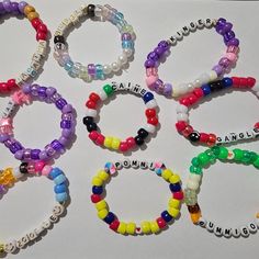 Handcrafted Kandi bracelets featuring characters from The Amazing Digital Circus! Each piece is unique, with slight variations in color and beads. Can't find your favorite character? Just let me know! All bracelets are made with high-quality materials and come with elastic strings for a comfortable fit. I offer refunds until the products are shipped, and I'm here to address any questions or concerns. Please note that these bracelets contain small parts and are not suitable for children under thr Themed Jewelry With Round Letter Beads, Novelty Colorful Beaded Bracelets As Gifts, Themed Beaded Bracelets With Round Beads As Gift, Customized Multicolor Novelty Jewelry, Themed Beaded Multicolor Jewelry, Novelty Jewelry With Colorful Beads For Friendship, Novelty Personalized Beaded Bracelets With Round Beads, Themed Personalized Round Bead Bracelets, Themed Handmade Wristband