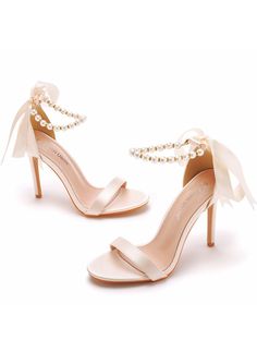 Our signature Unique Pearls Sandal stands out with its two graceful bow accents and an eye-catching stiletto heel. This contemporary yet classic design is carefully hand-crafted from the highest quality smooth leather, guaranteeing both style and durability. The Unique Sandal is an ideal choice for enhancing cropped hemlines, adding sophistication to a midi wedding dress for the bride-to-be, or elevating your style at any special occasion. Make a lasting impression at your next event with this exquisite footwear. Upper material: satinSole material: rubberToe shape: round headPopular elements: beadingPattern: solid colorSole technology: viscose shoesInner material: imitation leatherColor: white, beige, champagneSize: 6, 6.5, 7, 7.5, 8, 8.5, 9, 9.5, 10, 10.5 Princess Heels, Midi Wedding Dress, Blazers Shoes, Plus Size Cosplay, Pearl Sandals, Black Dress With Sleeves, Short Lace Dress, Sneaker Slippers, Printed Long Dresses