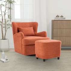 an orange chair and ottoman in a living room