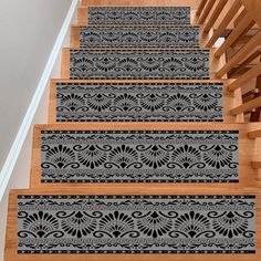 the stair treads are decorated with black and white designs