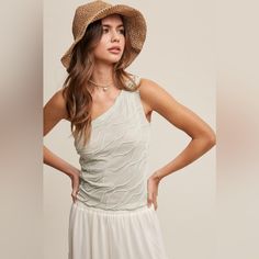 - Textured Cinched One Shoulder Top - Asymmetrical Neck - Sleeveless - Waist Length - Finished With Clean Hem - Model Is 5' 7.5" 33-24-34 And Wearing A Size Small Chic Textured Summer Tops, Chic One-shoulder Top For Beach, Asymmetrical One Shoulder Top For Summer Beach, Casual One Shoulder Top With Asymmetrical Neckline For Spring, Chic One-shoulder Sleeveless Top For Day Out, Fitted One Shoulder Top For Spring Vacation, Chic Sleeveless One Shoulder Top For Day Out, Fitted One Shoulder Top For Vacation In Spring, Casual Sleeveless One-shoulder Top For Vacation