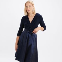 Bringing Together A Solid, Stretchy Top With A Flattering Fit And A Flared-Out Taffeta Skirt, This Joseph Ribkoff Two-Tone Dress Is A Must For Your Next Formal Cocktail Hour. A Belt Detail Gently Ties Everything Together At The Waist, Creating The Illusion Of An Hourglass Figure. You'll Be Amazed By The Ease And Elegance Of This Pretty Style. This Feminine And Flirty Dress Features An A-Line Skirt With A Broad Waistband And Cinched-In Waist And ¾ Sleeves. 96% Polyester, 4% Spandex No Pockets Bac Silk A-line Midi Dress For Dinner, Pleated V-neck Dress With Fitted Waist, Fitted A-line Wrap Dress With Tie Waist, Cocktail A-line Dress With Fitted Waist, Formal Pleated Full Skirt Midi Dress, Formal Pleated Midi Dress With Full Skirt, Evening Satin Midi Dress With Pleated Waist, Dressy Pleated Evening Dress For Formal Events, Formal Pleated Evening Dress