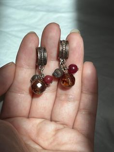 "Vintage, bead, dangle, earrings. The top of earrings are made of copper. Bead colors are maroon and amber brown.   Great, drop, hanging, earrings.  For pierced ears.  Colors are hues of browns and bronze. In good condition.  ** No returns or refunds.  measurements: 1 1/8\" L"