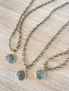 Denim crystal with a sparkly sheen paired with a lovely drop of faceted labradorite set in vermeil. Labradorite Necklace is 17.5” long with button and loop toggle closure. You can add a touch of elegance and sparkle to any outfit with the Denim crystal and faceted labradorite necklace. Gold Beaded Necklace With Labradorite Stones, Gold Labradorite Gemstone Beaded Necklace, Gold Labradorite Crystal Necklace With Gemstone Beads, Gold Crystal Necklaces With Gemstone Beads, Gold Bohemian Briolette Crystal Necklace, Handmade Gold Labradorite Beaded Necklaces, Gold Teardrop Labradorite Necklace, Adjustable Teardrop Gemstone Beaded Necklaces, Stone Bead Jewelry