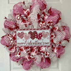 a valentine's day deco mesh wreath with hearts on the front and happy valentine's day sign