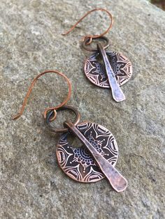 "These unique earrings are hand forged from pure organic copper. The metal has been oxidized for an aged, rustic look. Choose from copper ear wires as shown or from Sterling silver option at checkout. These earrings are versatile & perfect for everyday wear. Copper is the traditional gift for the 7th Anniversary. MEASUREMENTS & SPECIFICS: LENGTH: 2.5\" from earlobe WIDTH: 1\" diameter METAL: pure organic copper EAR WIRE: choose from Sterling silver or copper at checkout READY TO SHIP! Al Rust Colored Hammered Copper Jewelry, Artisan Metal Earrings In Rust Color, Artisan Metal Rust Earrings, Handmade Rustic Bronze Earrings, Rustic Bronze Earrings With Patina, Handmade Artisan Rust Earrings, Artisan Handmade Rust Earrings, Rustic Hammered Copper Earrings, Rust-colored Soldered Copper Earrings