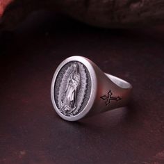 🍁Special Collection for Fall & Halloween Season!🍁 ✝️Silver Saint Guadalupe Signet Ring | Sterling Silver Religious Catholic Rings | Christmas Gift Jewelry Ideas | Handmade Personalized ✝️ Blessed with a beautiful prayer, this signet ring is the perfect way to ensure you don't miss out on Saint Guadalupe's presence in your life. Treat yourself to beautiful jewelry with our Silver Saint Guadalupe Signet Ring. Intricate details make this ring a wonderful addition to any collection. The quality of Catholic Ring Men, Symbolic Nickel-free Oval Jewelry, Symbolic Oval Nickel-free Jewelry, Nickel-free Oval Symbolic Jewelry, Adjustable Sterling Silver Christmas Jewelry, Nickel Free Sterling Silver Christmas Jewelry, Silver Ring For Christmas Gift, Silver Rings For Christmas Anniversary, Nickel-free Sterling Silver Christmas Jewelry