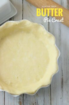 an uncooked pie crust sitting on top of a wooden table