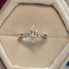 an engagement ring in a velvet box